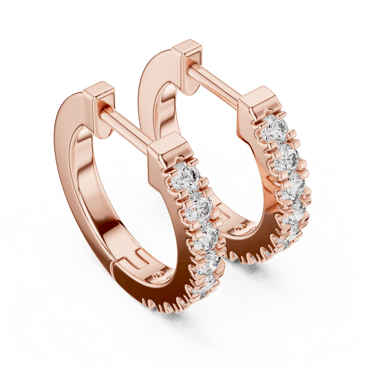 Diamond huggie hoop earrings featuring a row of sparkling round stones with a secure hinged closure by Aortas Jewels.