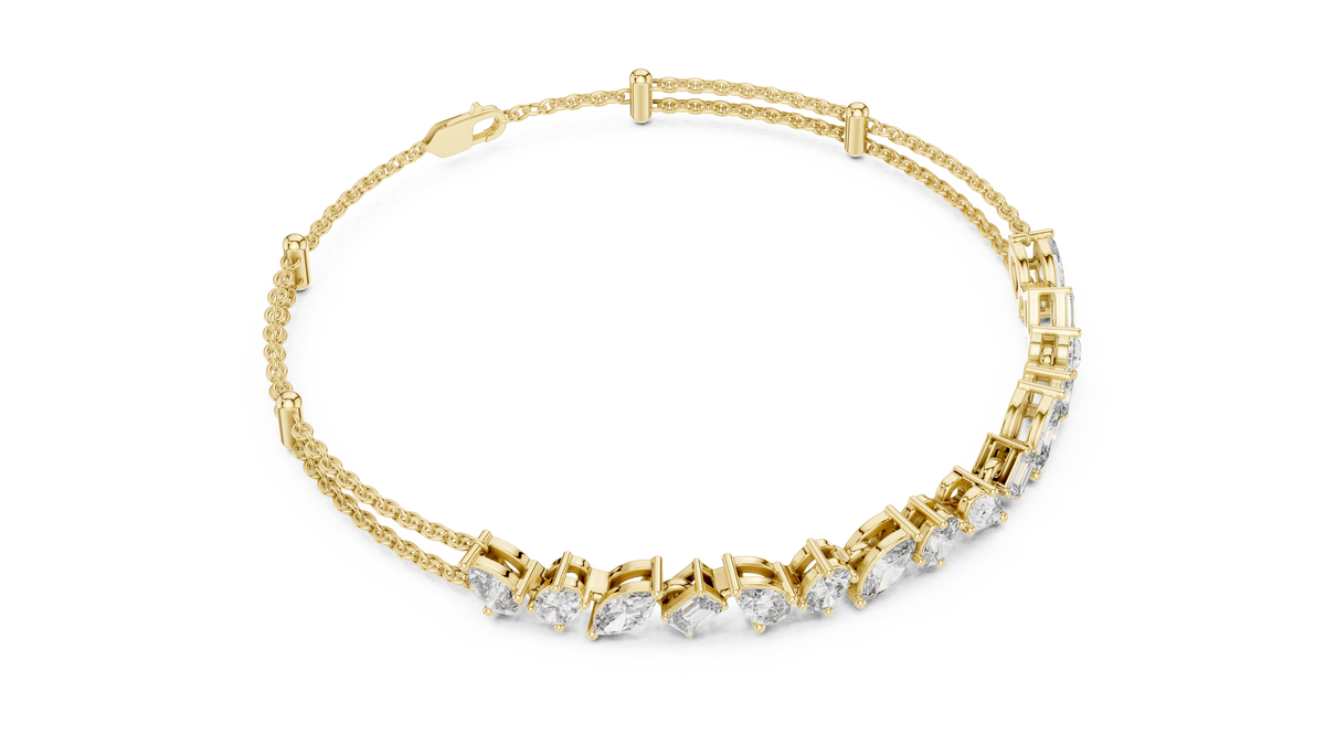 Marquise and emerald diamond tennis bracelet featuring mixed-cut sparkling stones in an elegant chain design by Aortas Jewels.