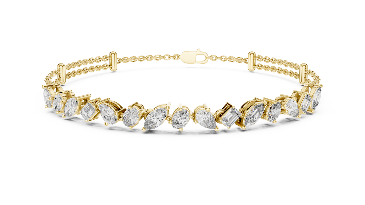 Marquise and emerald diamond tennis bracelet featuring mixed-cut sparkling stones in an elegant chain design by Aortas Jewels.