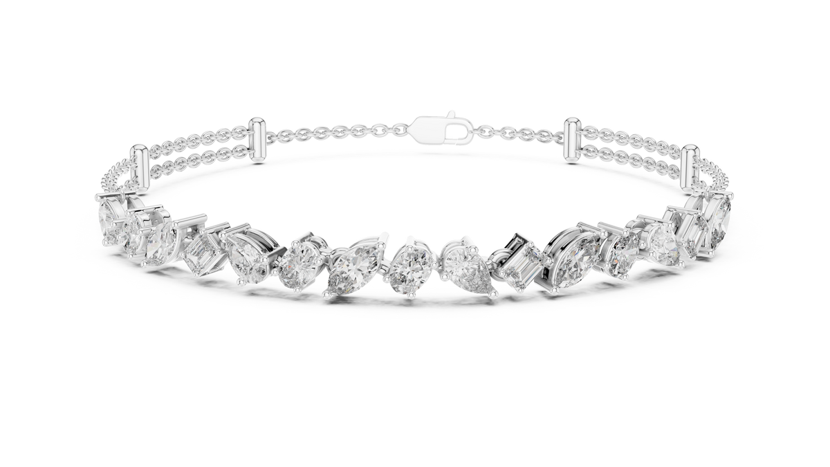 Marquise and emerald diamond tennis bracelet featuring mixed-cut sparkling stones in an elegant chain design by Aortas Jewels.