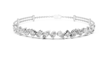 Marquise and emerald diamond tennis bracelet featuring mixed-cut sparkling stones in an elegant chain design by Aortas Jewels.