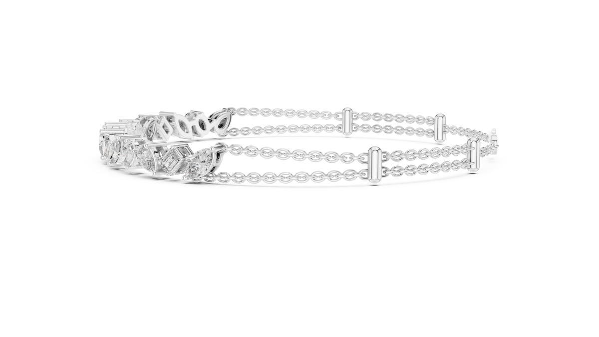Marquise and emerald diamond tennis bracelet featuring mixed-cut sparkling stones in an elegant chain design by Aortas Jewels.