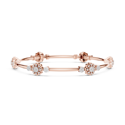 Floral charm crystal bangle bracelet featuring sparkling flower charms, decorative spacer beads, and a polished silver-tone finish by Aortas Jewels.