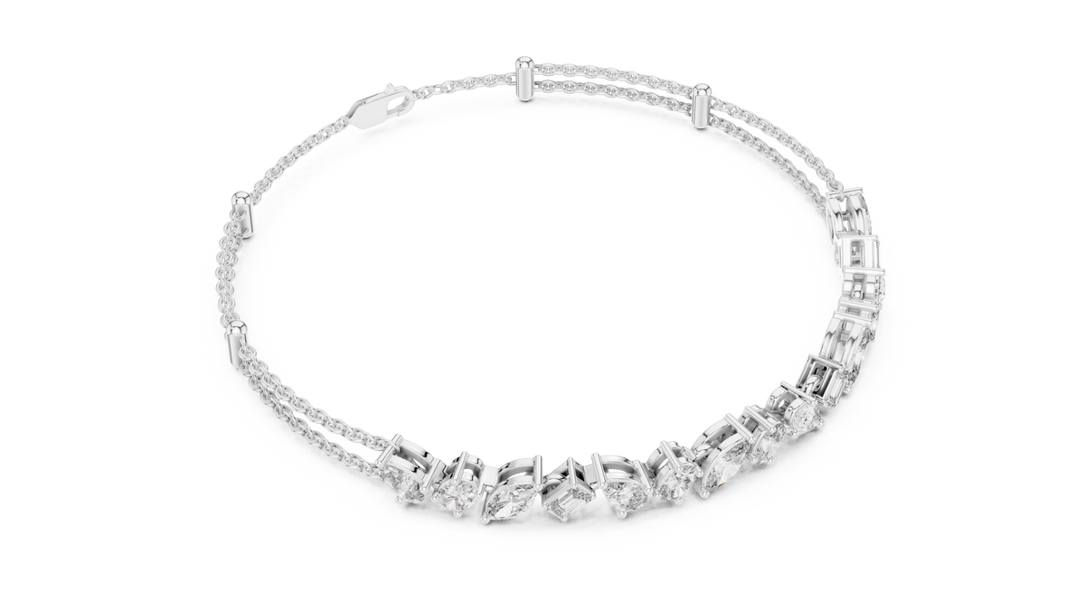 Marquise and emerald diamond tennis bracelet featuring mixed-cut sparkling stones in an elegant chain design by Aortas Jewels.