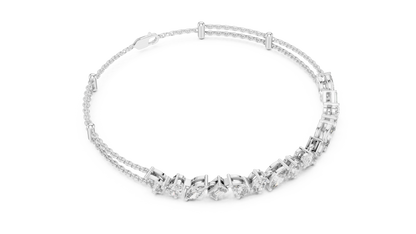 Marquise and emerald diamond tennis bracelet featuring mixed-cut sparkling stones in an elegant chain design by Aortas Jewels.