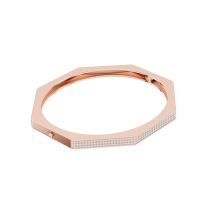 Geometric diamond bangle bracelet featuring a sleek octagonal design with a pavé-set diamond accent panel and polished finish by Aortas Jewels.