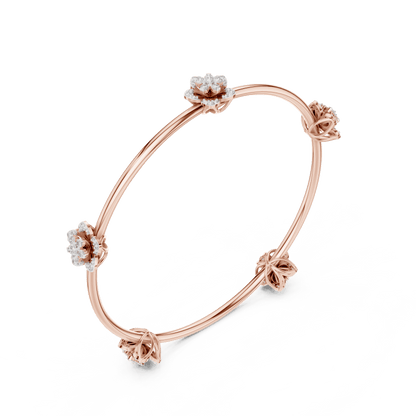 Blooming Floral & Leaf Crystal Bangle Bracelet featuring sparkling flower blossoms and leaf-inspired charms on a polished silver-tone open bangle by Aortas Jewels.