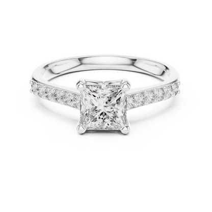 Classic pavé solitaire diamond engagement ring featuring a round-cut center stone in a four-prong setting with a sparkling pavé diamond band by Aortas Jewels.