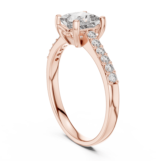 Classic pavé solitaire diamond engagement ring featuring a round-cut center stone in a four-prong setting with a sparkling pavé diamond band by Aortas Jewels.