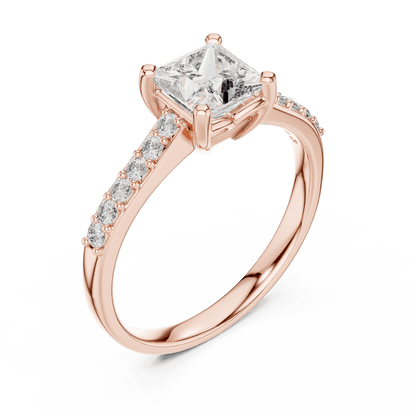 Classic pavé solitaire diamond engagement ring featuring a round-cut center stone in a four-prong setting with a sparkling pavé diamond band by Aortas Jewels.