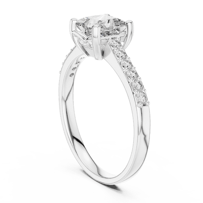 Classic pavé solitaire diamond engagement ring featuring a round-cut center stone in a four-prong setting with a sparkling pavé diamond band by Aortas Jewels.