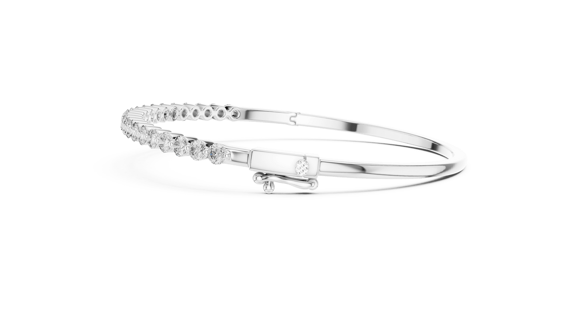 Classic round diamond hinged bangle featuring brilliant round-cut diamonds set along a polished white gold bracelet with a secure clasp by Aortas Jewels.