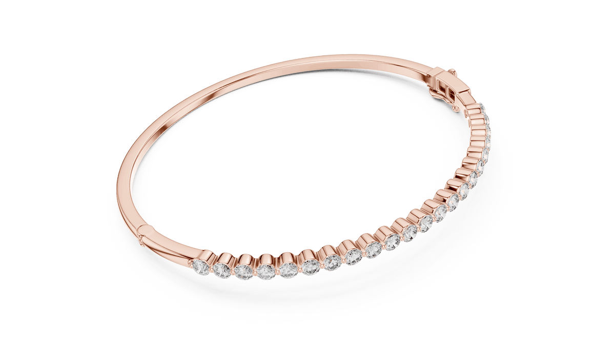 Classic round diamond hinged bangle featuring brilliant round-cut diamonds set along a polished white gold bracelet with a secure clasp by Aortas Jewels.