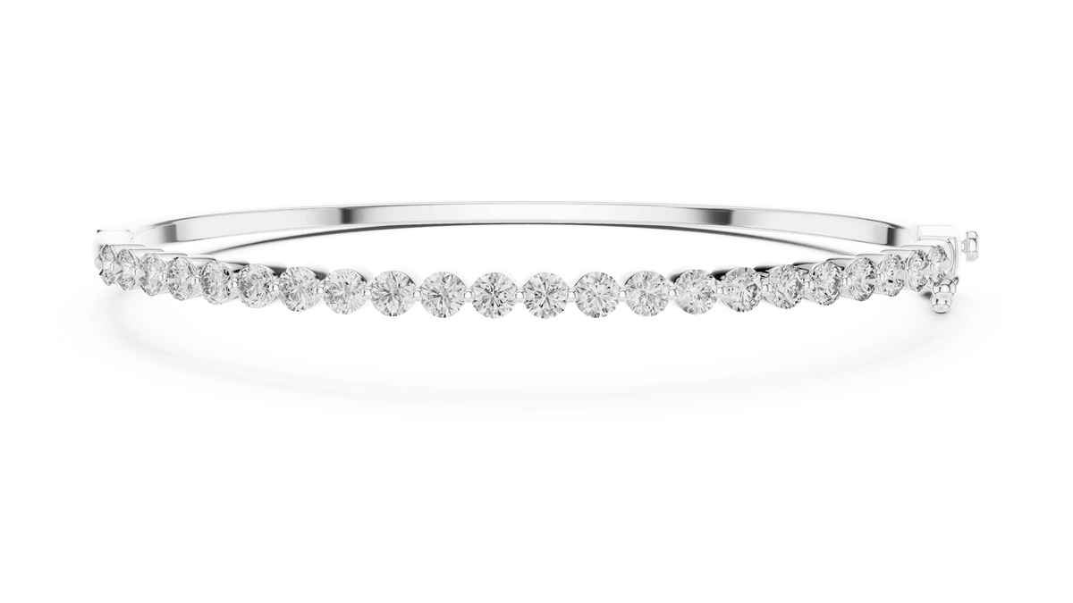 Classic round diamond hinged bangle featuring brilliant round-cut diamonds set along a polished white gold bracelet with a secure clasp by Aortas Jewels.