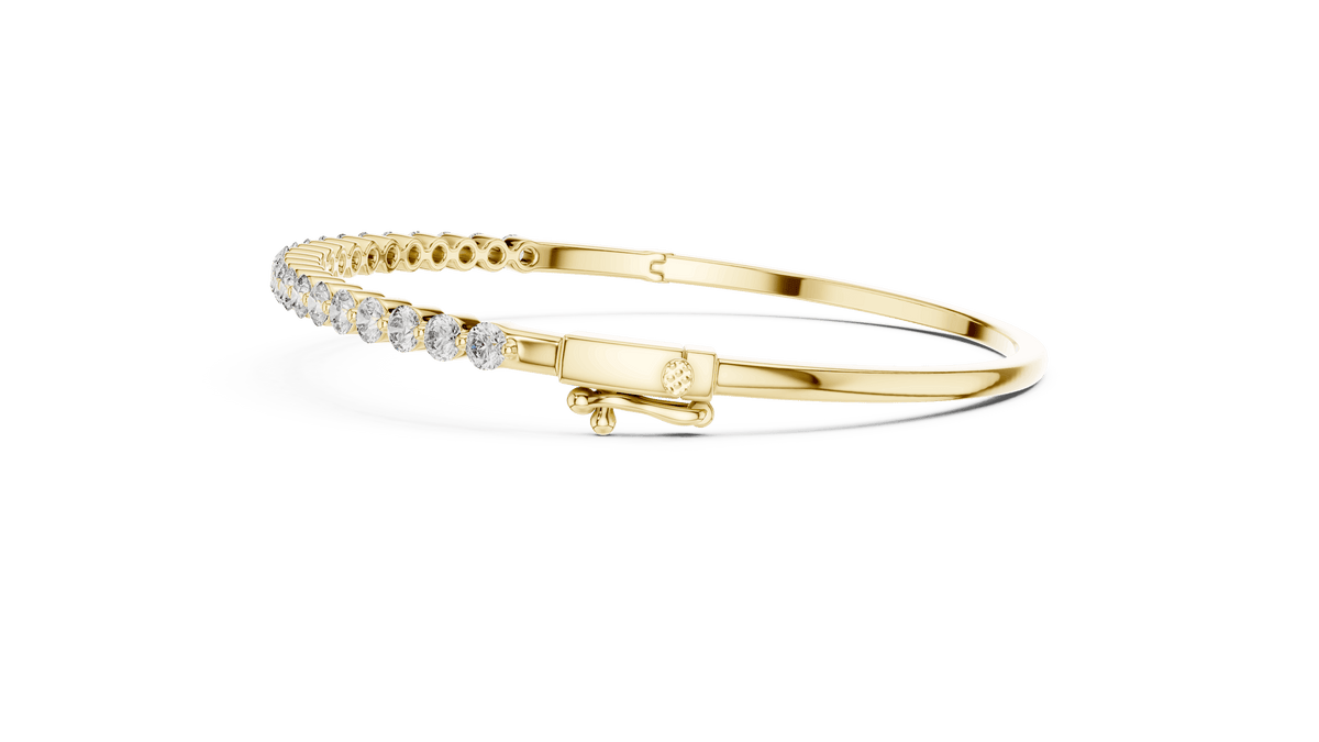 Classic round diamond hinged bangle featuring brilliant round-cut diamonds set along a polished white gold bracelet with a secure clasp by Aortas Jewels.