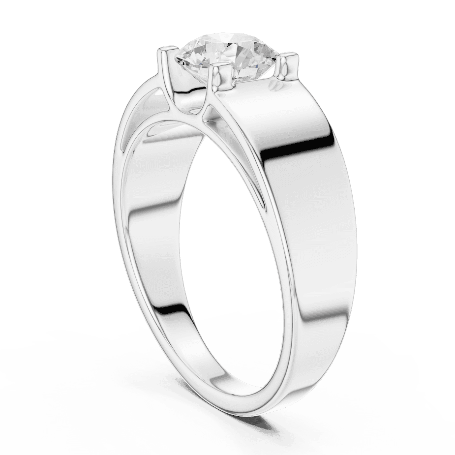 Classic solitaire diamond engagement ring featuring a brilliant round-cut stone in a four-prong setting with a sleek polished band by Aortas Jewels.