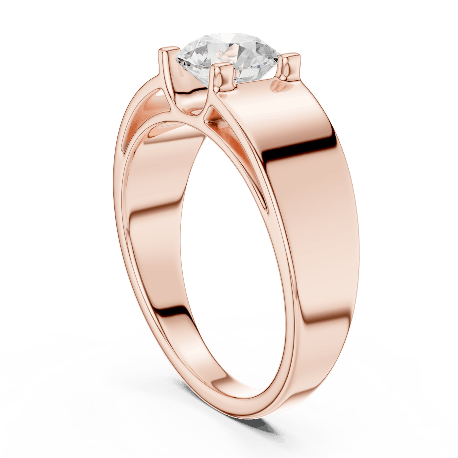 Classic solitaire diamond engagement ring featuring a brilliant round-cut stone in a four-prong setting with a sleek polished band by Aortas Jewels.