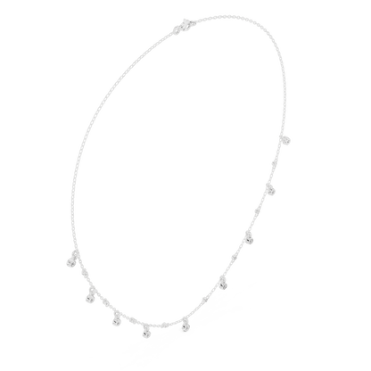 Dainty diamond dangle necklace featuring delicate sparkling drop charms on a fine chain by Aortas Jewels.