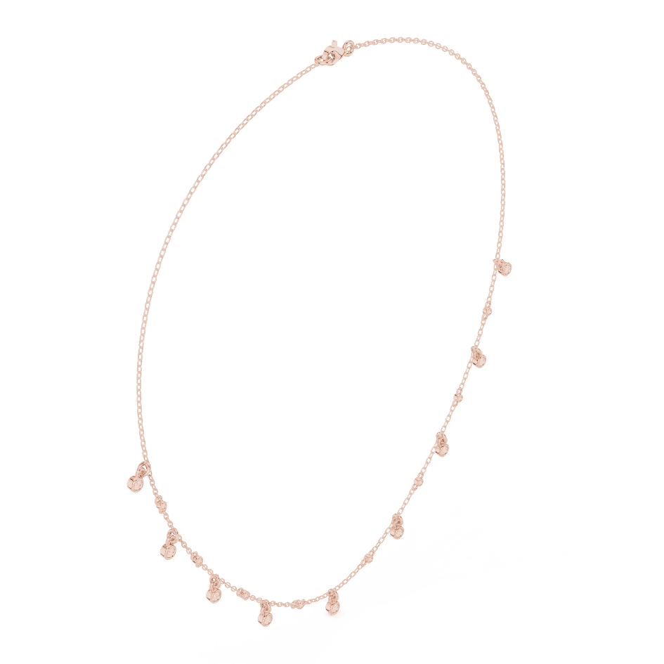 Dainty diamond dangle necklace featuring delicate sparkling drop charms on a fine chain by Aortas Jewels.