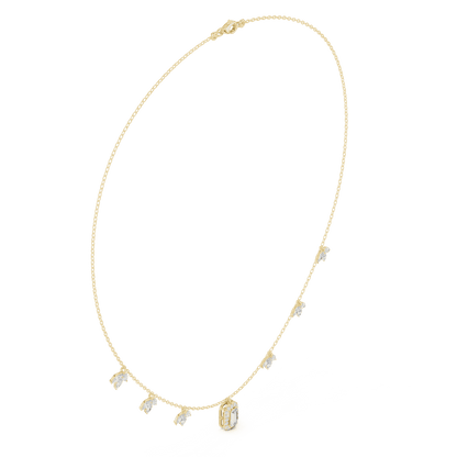 Emerald-cut diamond charm necklace featuring a delicate chain with sparkling station accents and a modern centerpiece by Aortas Jewels.