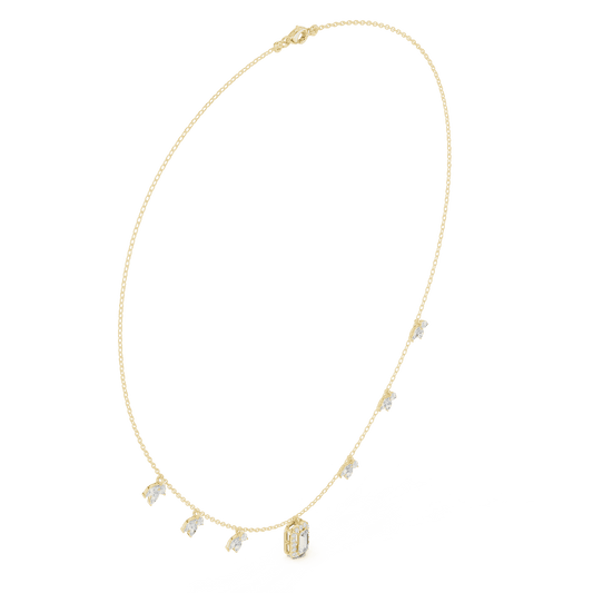 Emerald-cut diamond charm necklace featuring a delicate chain with sparkling station accents and a modern centerpiece by Aortas Jewels.