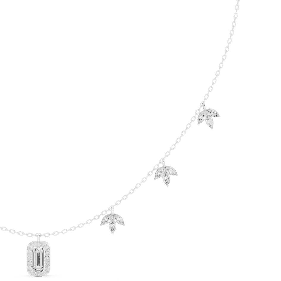 Emerald-cut diamond charm necklace featuring a delicate chain with sparkling station accents and a modern centerpiece by Aortas Jewels.