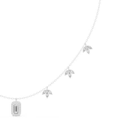 Emerald-cut diamond charm necklace featuring a delicate chain with sparkling station accents and a modern centerpiece by Aortas Jewels.