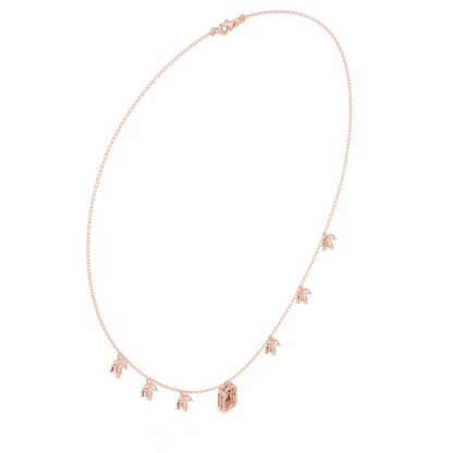 Emerald-cut diamond charm necklace featuring a delicate chain with sparkling station accents and a modern centerpiece by Aortas Jewels.