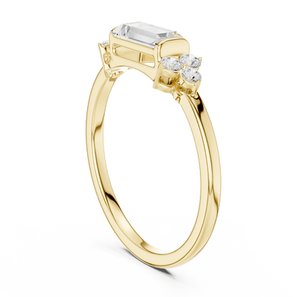 Emerald Cut Diamond Three-Stone Engagement Ring featuring an emerald-cut center stone with round diamond side accents on a polished band by Aortas Jewels.