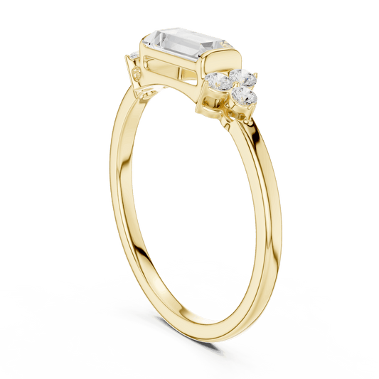 Emerald Cut Diamond Three-Stone Engagement Ring featuring an emerald-cut center stone with round diamond side accents on a polished band by Aortas Jewels.
