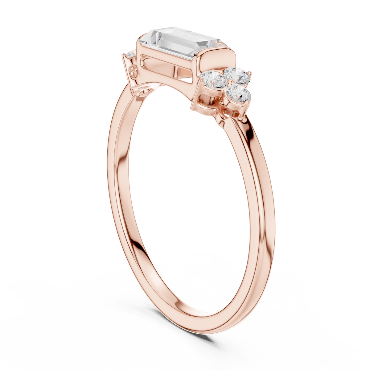 Emerald Cut Diamond Three-Stone Engagement Ring featuring an emerald-cut center stone with round diamond side accents on a polished band by Aortas Jewels.