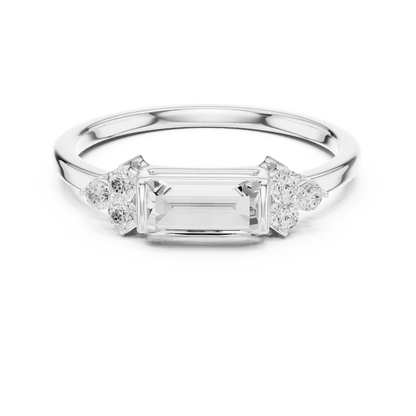 Emerald Cut Diamond Three-Stone Engagement Ring featuring an emerald-cut center stone with round diamond side accents on a polished band by Aortas Jewels.