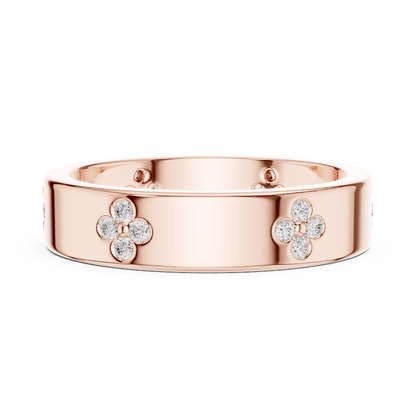 Floral Diamond Comfort Fit Wedding Band featuring delicate round diamond flower clusters on a wide polished band by Aortas Jewels.