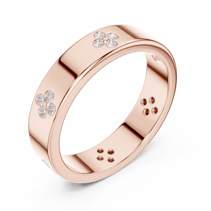 Floral Diamond Comfort Fit Wedding Band featuring delicate round diamond flower clusters on a wide polished band by Aortas Jewels.