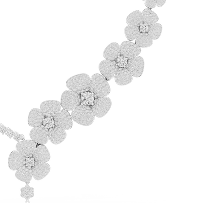 Floral diamond statement necklace featuring sparkling flower motifs and an elegant drop centerpiece by Aortas Jewels.