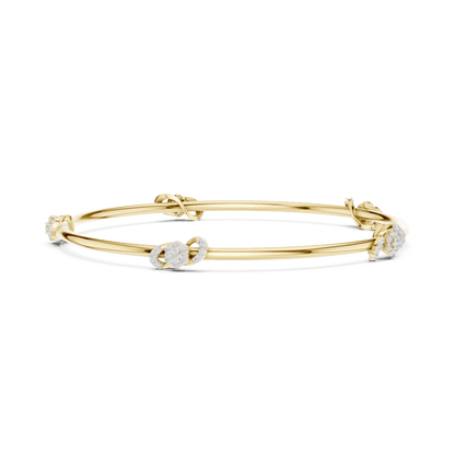 Minimalist floral crystal bangle bracelet featuring delicate flower-inspired charms on a sleek polished silver-tone bangle by Aortas Jewels.