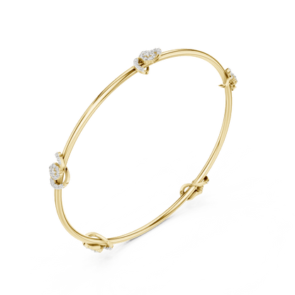 Minimalist floral crystal bangle bracelet featuring delicate flower-inspired charms on a sleek polished silver-tone bangle by Aortas Jewels.