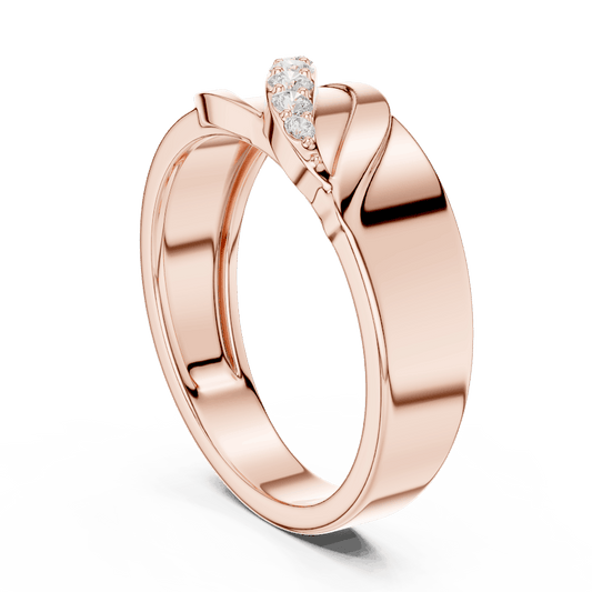 Modern twist solitaire diamond ring featuring a sleek crossover band and sparkling round center stone by Aortas Jewels.