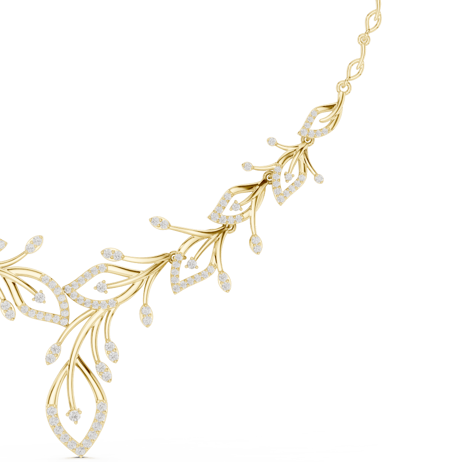 Nature-inspired yellow gold leaf necklace with an elegant vine design and sparkling stone accents by Aortas Jewels.