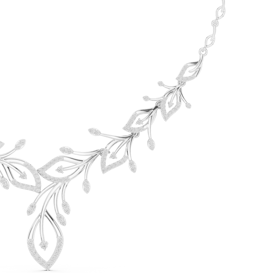 Nature-inspired yellow gold leaf necklace with an elegant vine design and sparkling stone accents by Aortas Jewels.