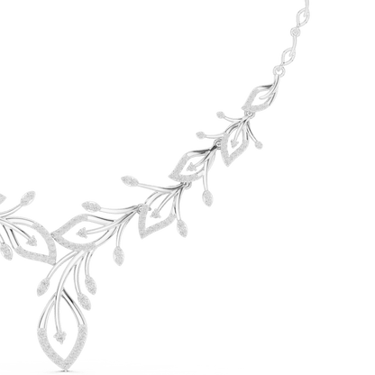 Nature-inspired yellow gold leaf necklace with an elegant vine design and sparkling stone accents by Aortas Jewels.