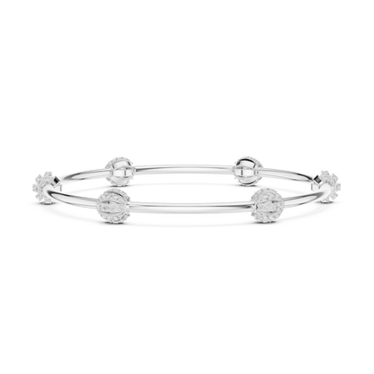 Elegant pavé crystal charm bangle bracelet featuring sparkling bead accents on a sleek polished silver-tone bangle by Aortas Jewels.