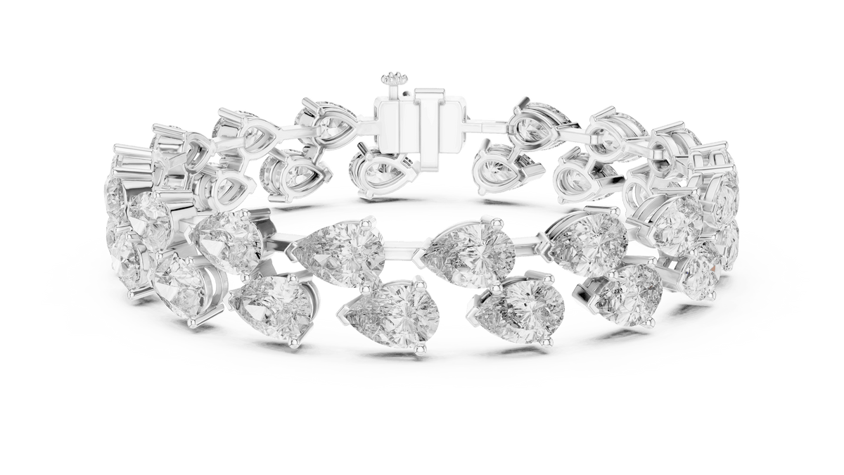 Pear Cut Diamond Tennis Bracelet featuring a double row of sparkling pear-shaped stones with a secure box clasp by Aortas Jewels.