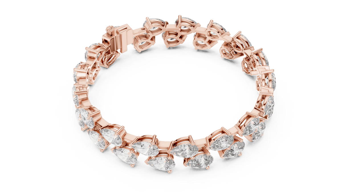 Pear Cut Diamond Tennis Bracelet featuring a double row of sparkling pear-shaped stones with a secure box clasp by Aortas Jewels.