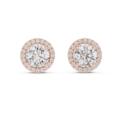 Round halo diamond stud earrings featuring brilliant center stones surrounded by sparkling halo accents with secure stud backs by Aortas Jewels.