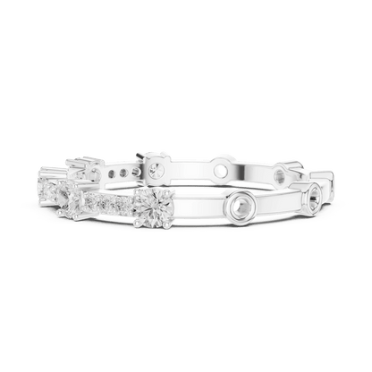 Shared Prong Diamond Eternity Band featuring brilliant round diamonds in a polished half eternity shared-prong setting by Aortas Jewels.