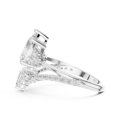 Three-stone diamond engagement ring featuring a brilliant round center stone, sparkling side stones, and a pavé-set band by Aortas Jewels.