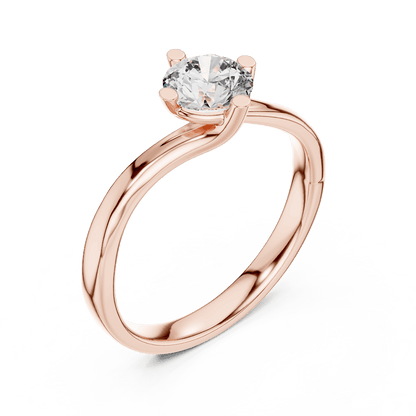 Twisted solitaire diamond engagement ring featuring a round-cut center stone in a four-prong setting with a sleek sculpted twisted band by Aortas Jewels.