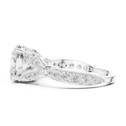 Vintage Leaf Solitaire Diamond Engagement Ring featuring a round brilliant center stone, marquise leaf motifs, and pavé diamond accents on a polished band by Aortas Jewels.